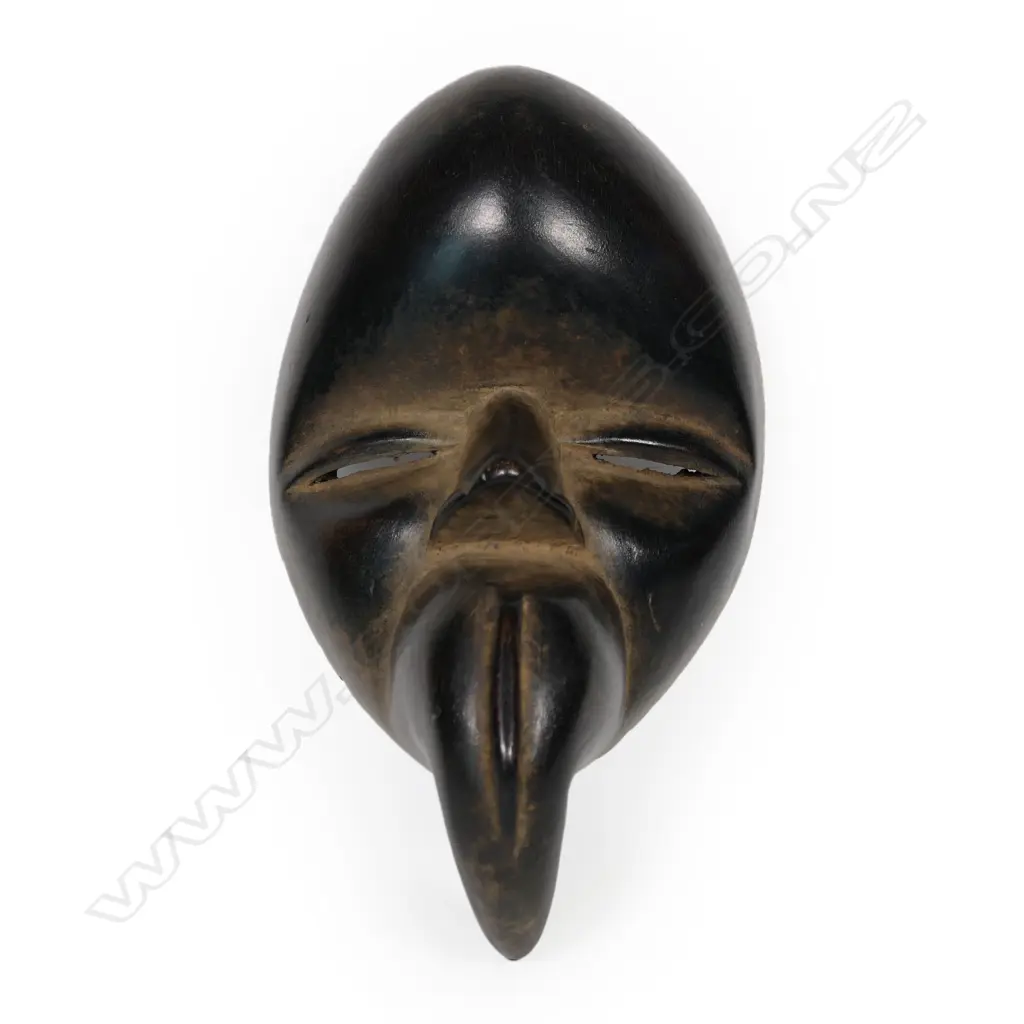 A carved Bird mask Image 1++