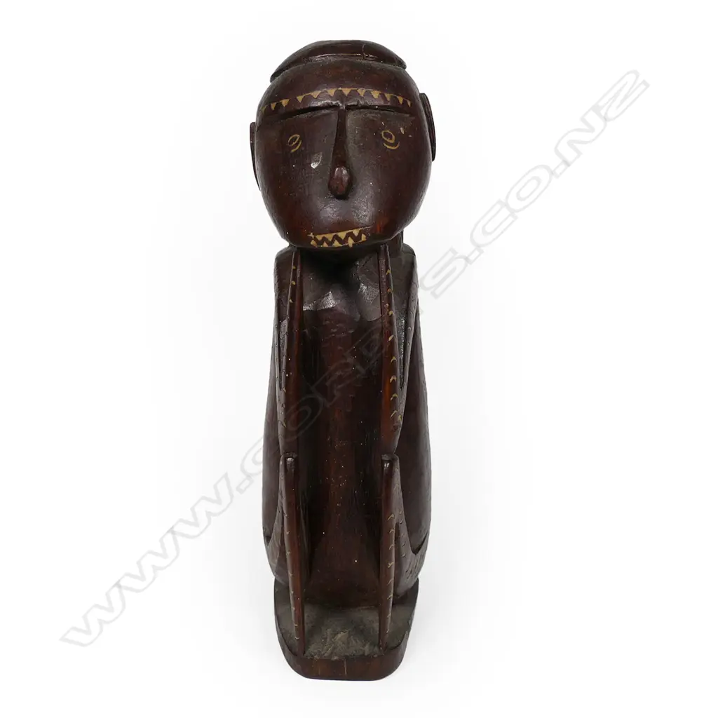 A carved tribal figure Image 1++
