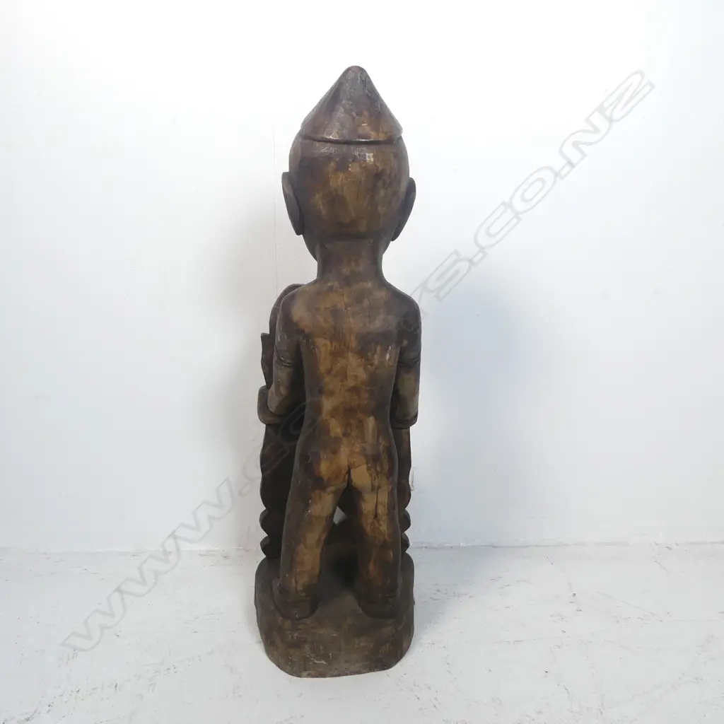 A carved tribal figure Image 1++