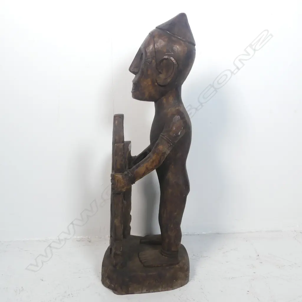 A carved tribal figure Image 1++
