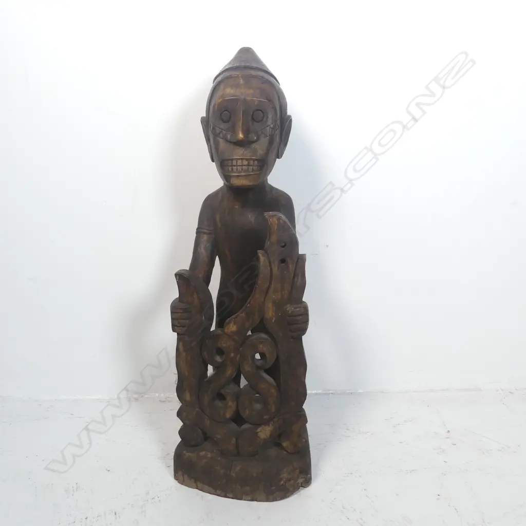 A carved tribal figure Image 1++