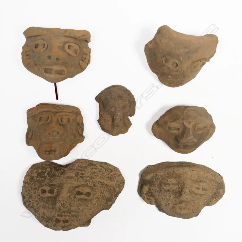 A Group of Seven Pre-Columbian Portrait Masks, Image 1++