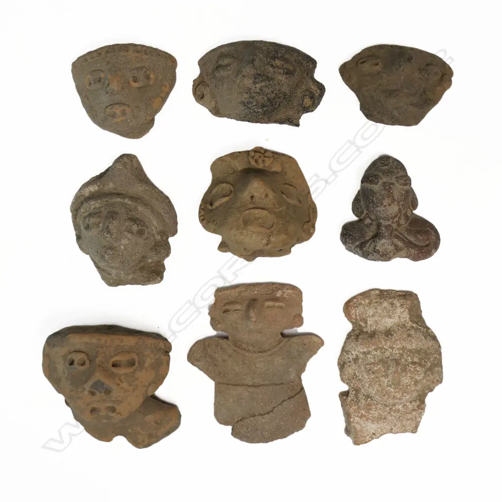 A Group of Nine Pre-Columbian Portrait Masks, tallest 85mm Image 1++