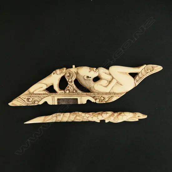 Carved with a recumbent woman and  a dog with carved crocodile form support,