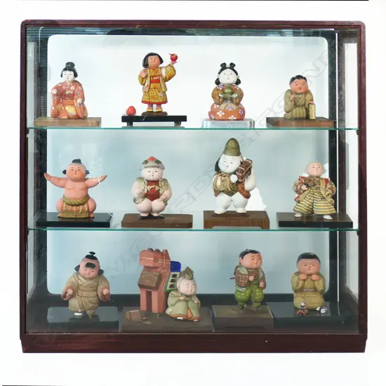 A Collection of Twelve Japanese Porcelain Dolls in A Glazed Display Case,