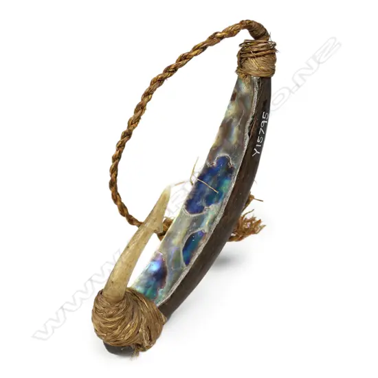 An old Māori trolling lure (pa kahawai) with traditional tapered formed wooden body,