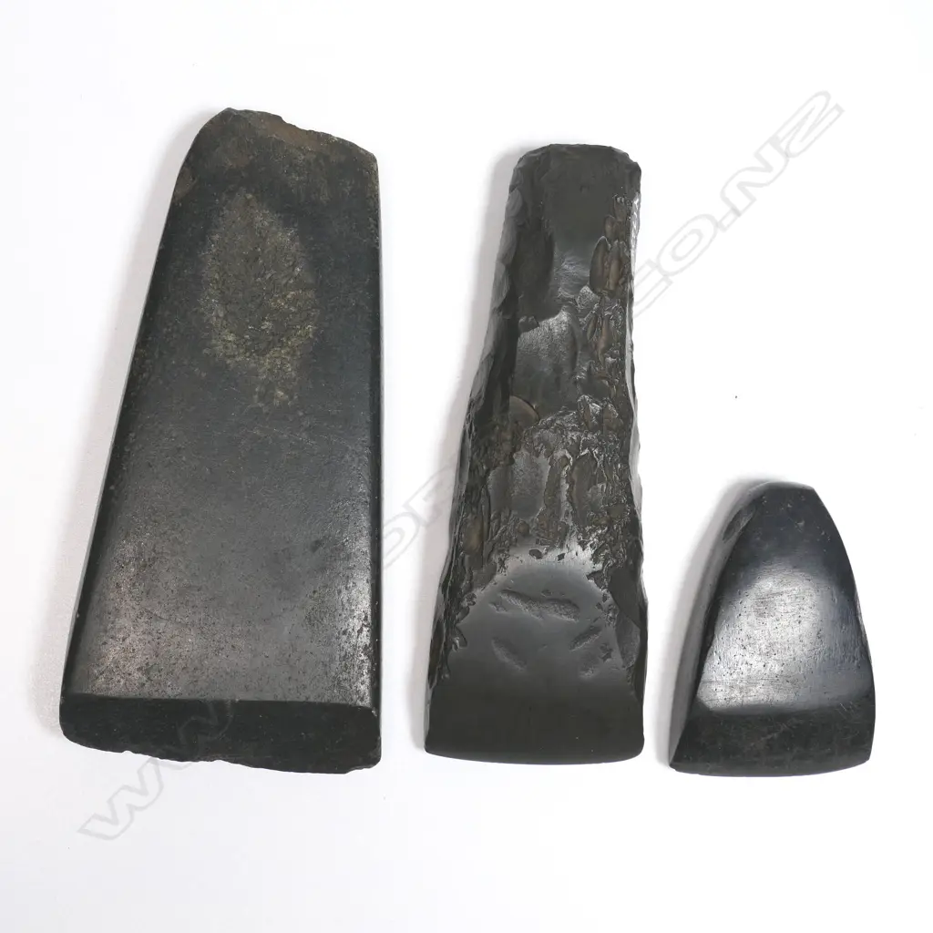 Three Māori stone toki (adzes) L.135, 130 and 64mm. Registered Y.17339, Y17338 and Y.17314. Provenance: Ex. The Estate of John Perry. Image 1++
