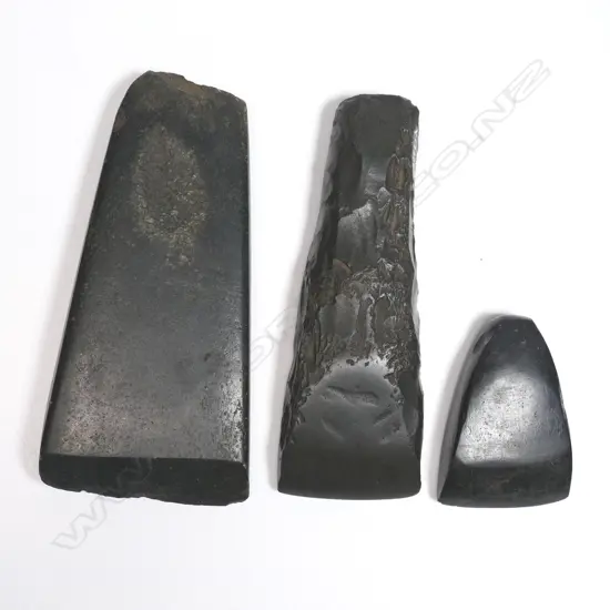 Three Māori stone toki (adzes) L.135, 130 and 64mm. Registered Y.17339, Y17338 and Y.17314. Provenance: Ex. The Estate of John Perry.