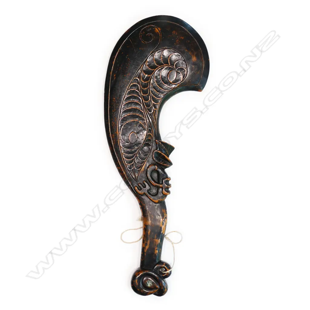 A 20thC Māori carved kauri waihaika hand club Image 1++