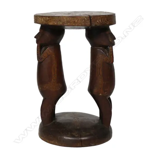 A Massim Trobriand Islands stool with twin figure supports,