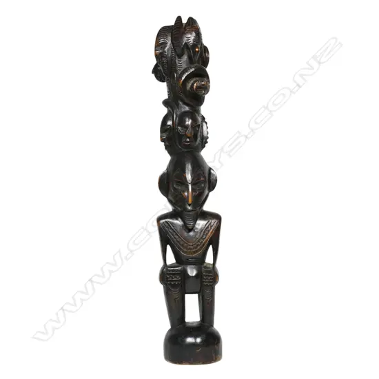 A vintage PNG carved wooden totem figure,