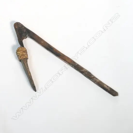 A hafted stone adze,