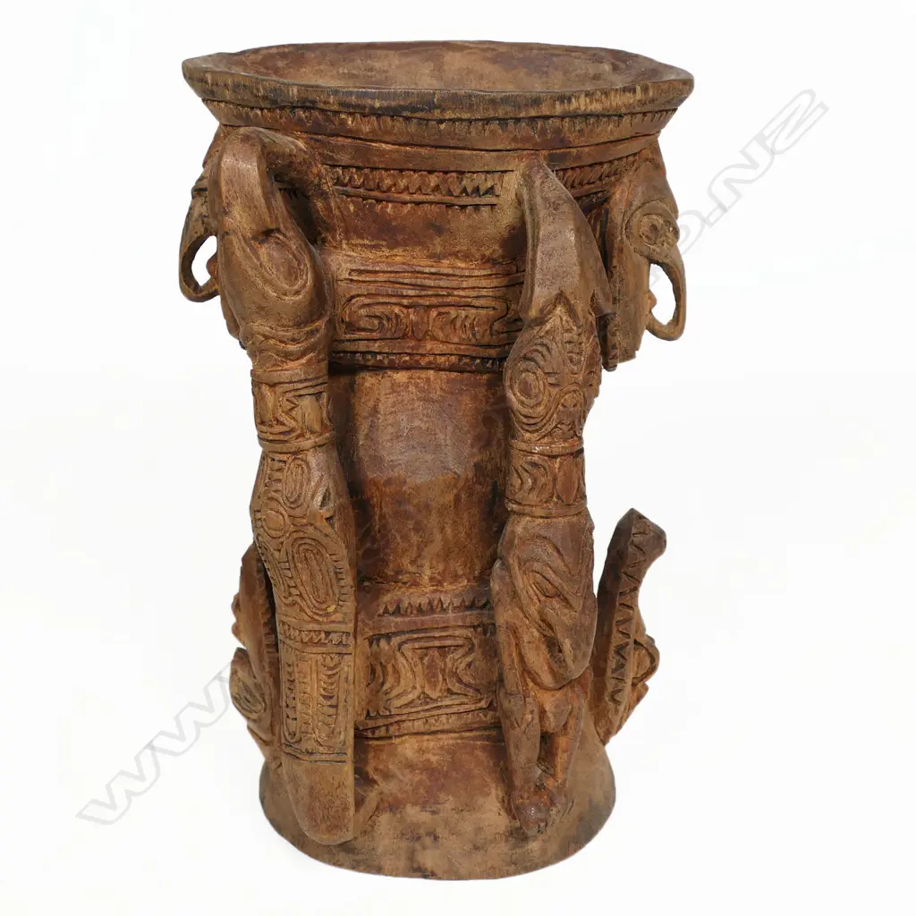 PNG finely carved pigment pot with stylised figured handles crocodiles and masks. H.200mm. Provenance: Ex. The Estate of John Perry. Image 1++