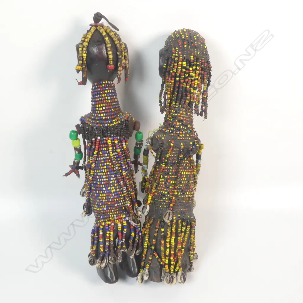 A pair of beaded African figures Image 1++