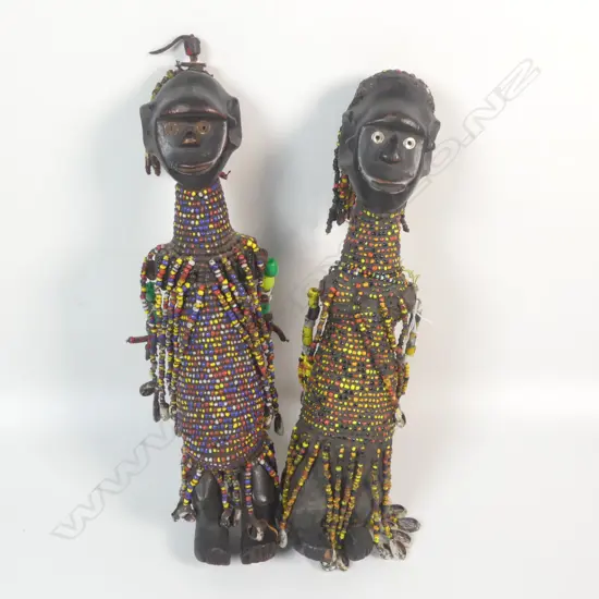 A pair of beaded African figures