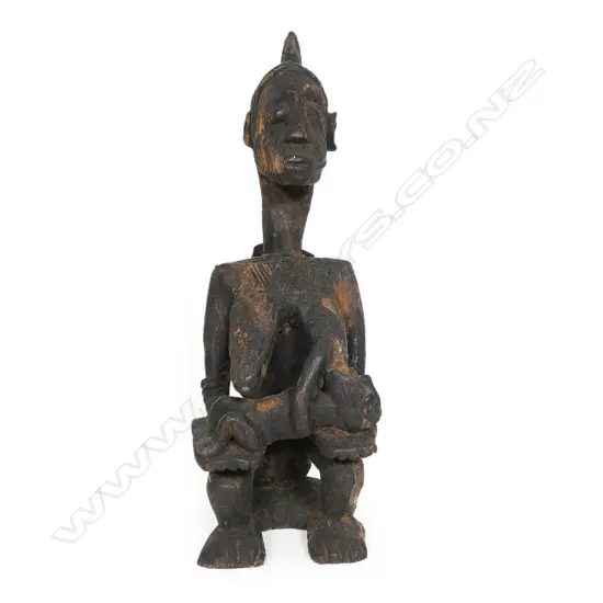 A Nigerian tribal carved wood mother and children figure group,