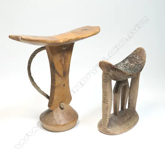 Two African carved wood headrests,