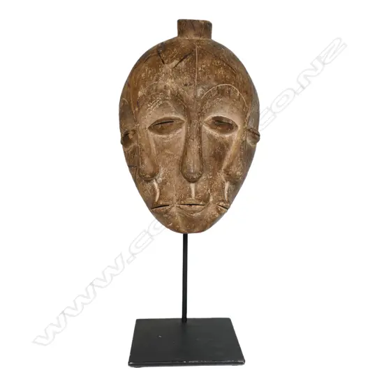 An African Lega Bwami society mask from the Democratic Republic of Congo,
