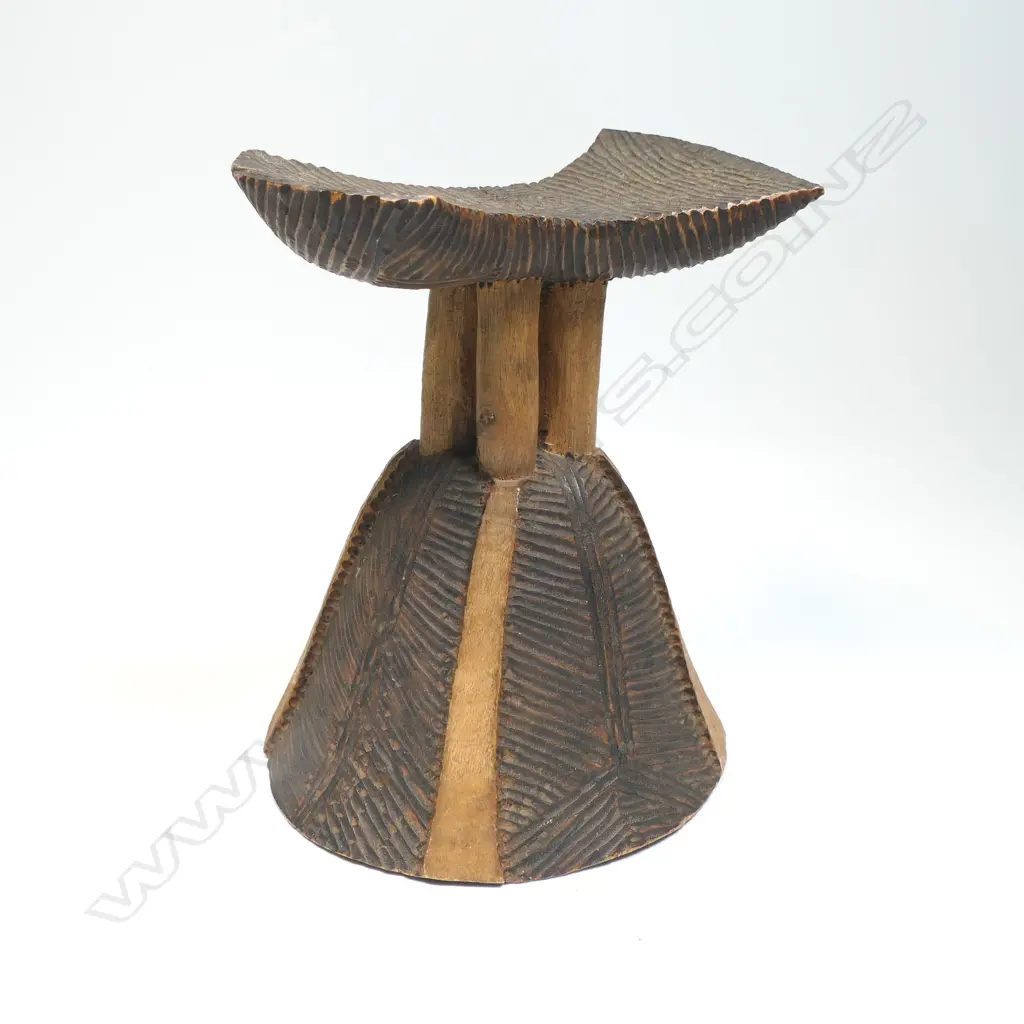 African carved wood headrest fine ridged carved decoration. Bell form base H.200mm.  Provenance: Ex. The Estate of John Perry. Image 1++