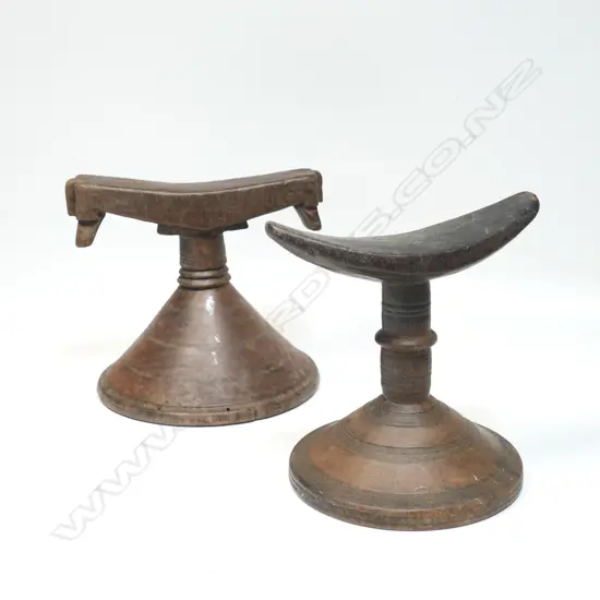 Two African carved wood headrests,