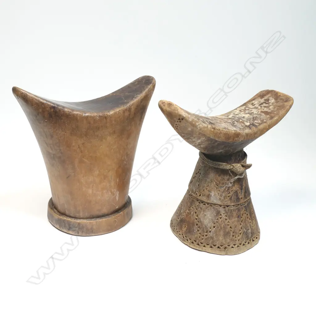 Two African carved wood headrests, tapered form, curved tops. H's.160mm. Provenance: Ex. The Estate of John Perry. Image 1++