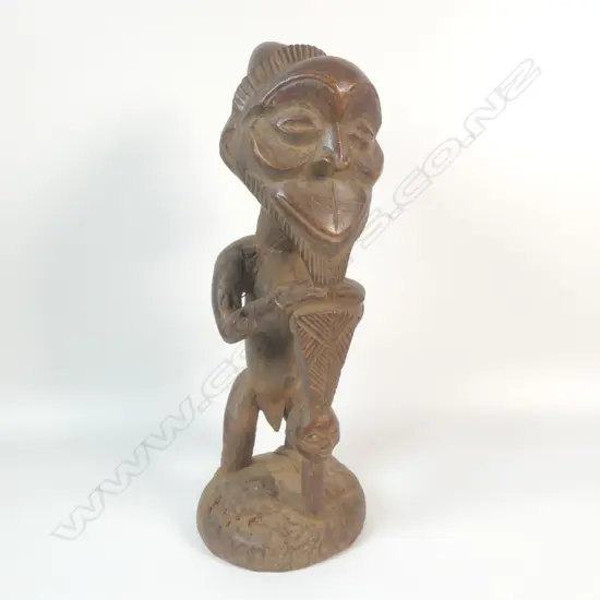 A carved African power figure,
