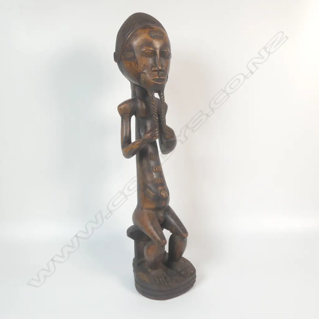 A carved Baoule figure Image 1++