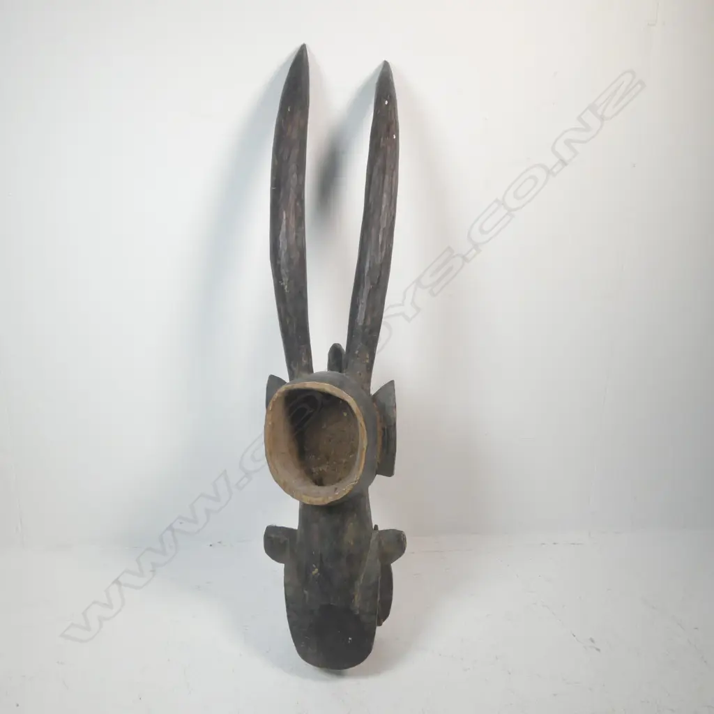 A carved African mask from Ivory Coast Image 1++