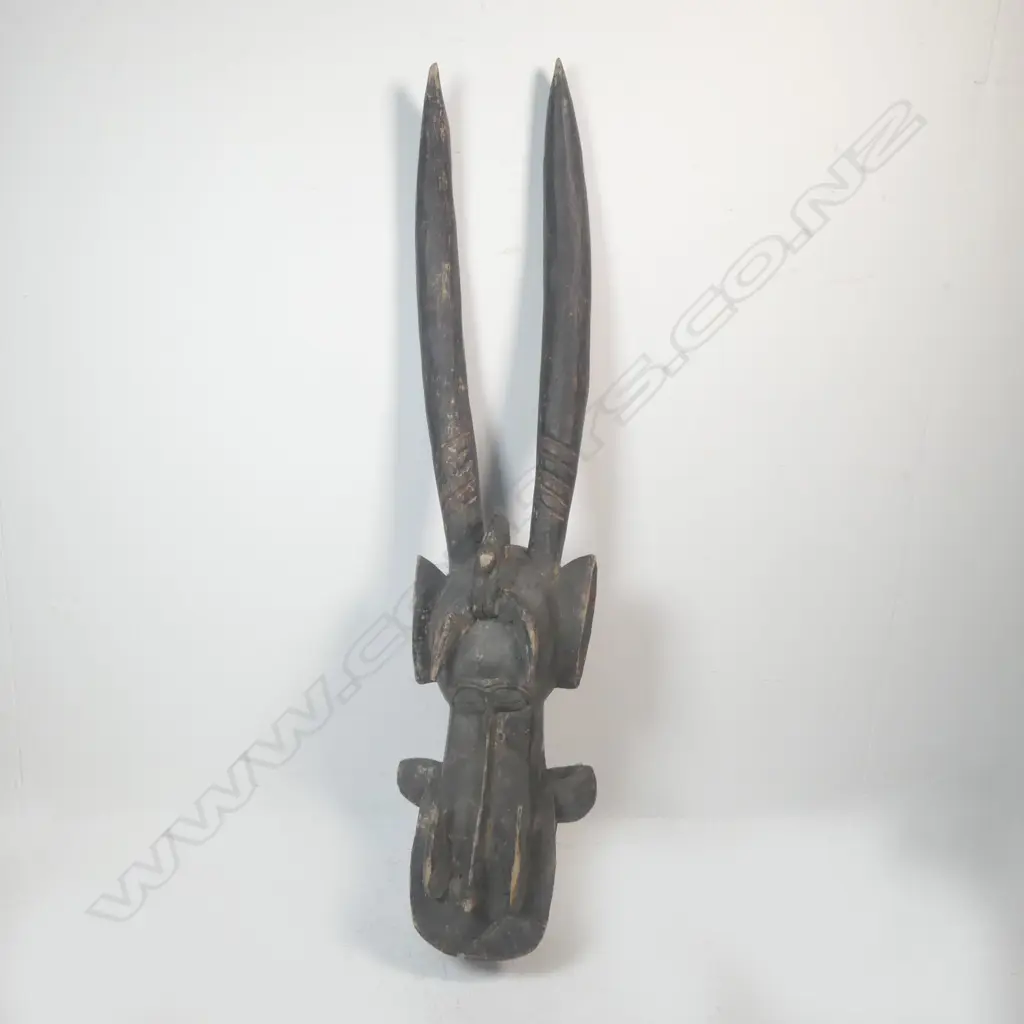 A carved African mask from Ivory Coast Image 1++