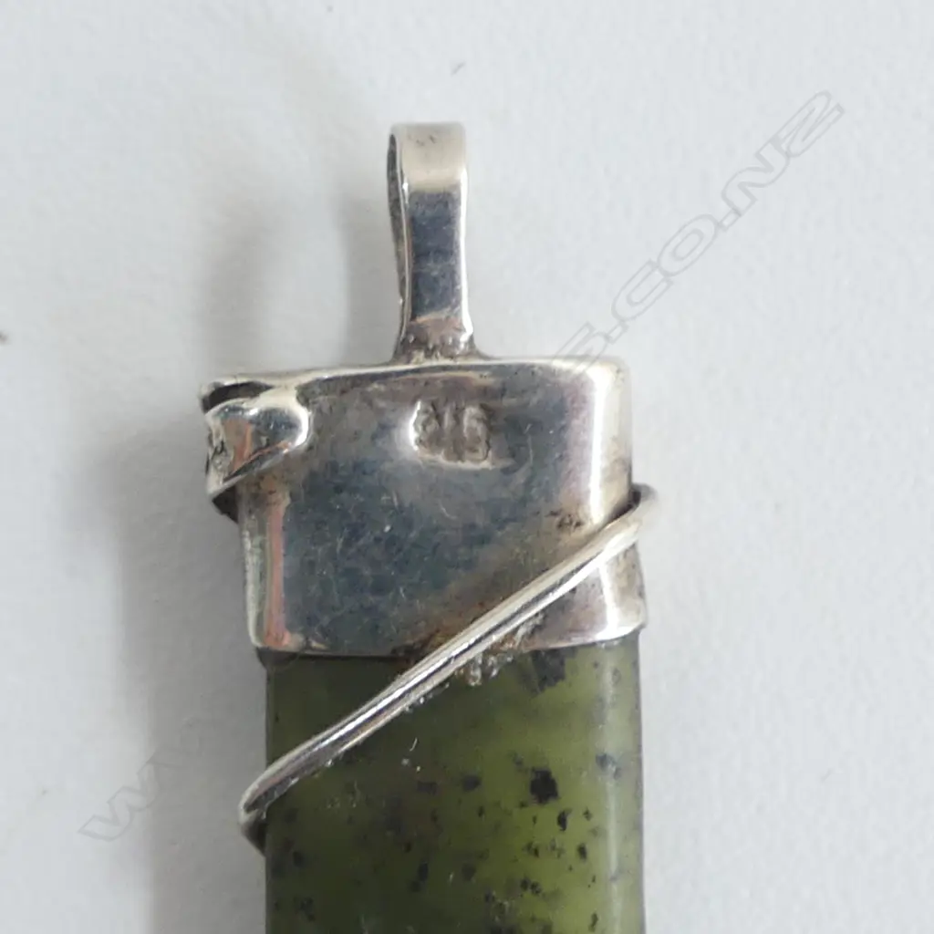 Two pounamu & silver mounted pendants Image 1++