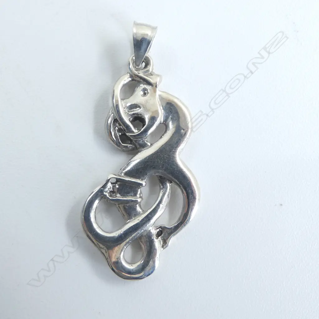 Contemporary Maori cast silver scrolling Mania pendant tail looping through mouth H.50mm Image 1++