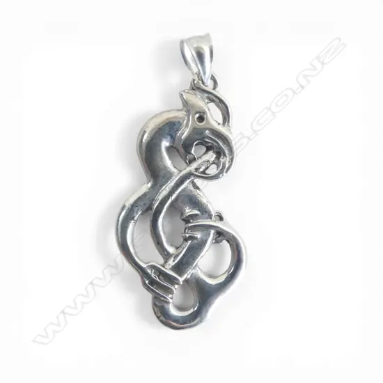 Contemporary Maori cast silver scrolling Mania pendant tail looping through mouth H.50mm