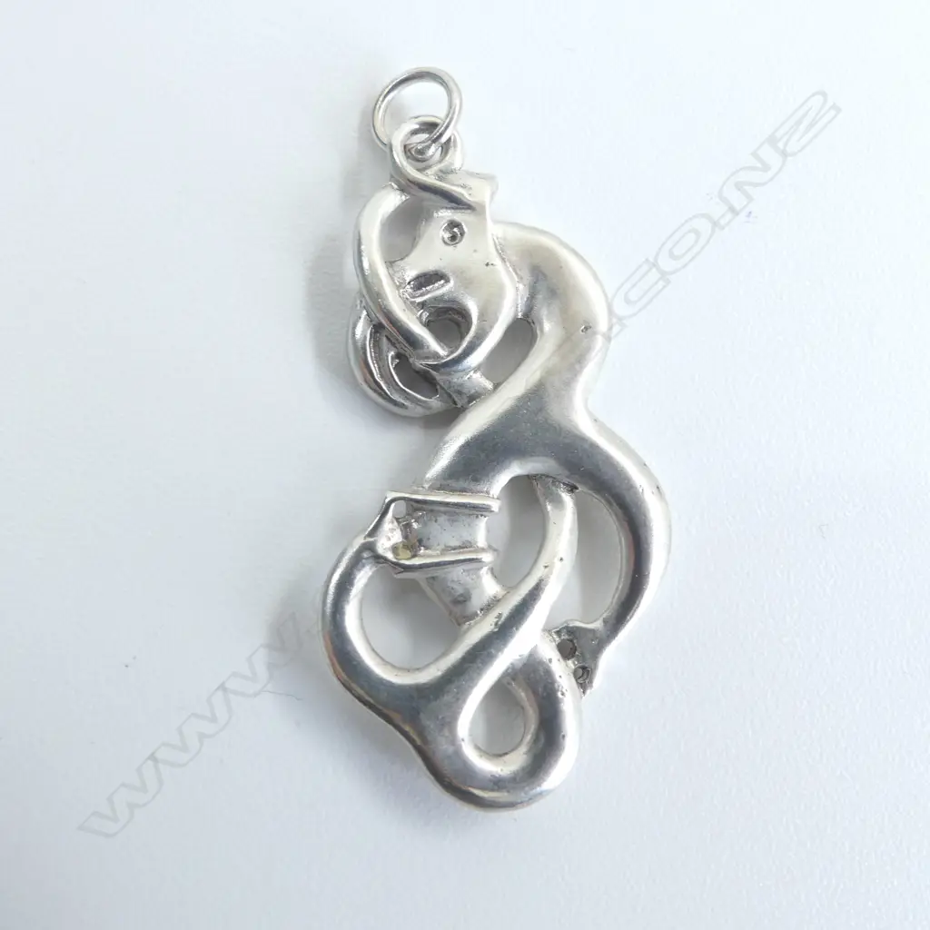 Contemporary Maori cast silver scrolling Mania pendant tail looping through mouth H.50mm Image 1++