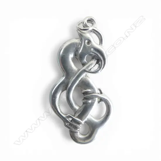 Contemporary Maori cast silver scrolling Mania pendant tail looping through mouth H.50mm