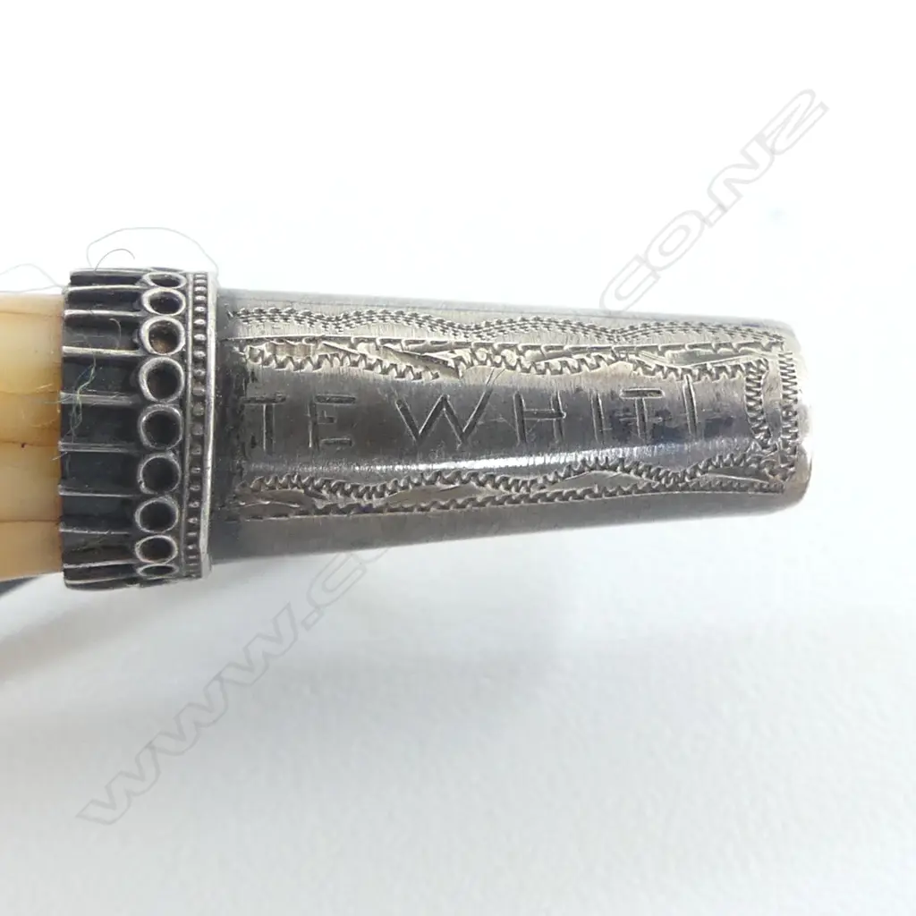 A vintage 'Te Whiti' engraved marine ivory tooth with silver brooch fittings Image 1++