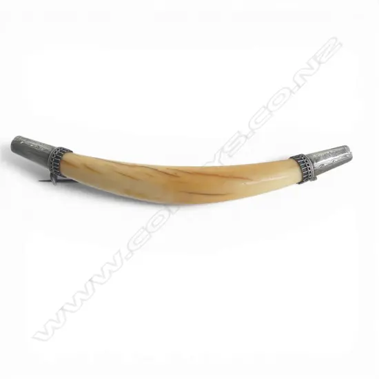 A vintage 'Te Whiti' engraved marine ivory tooth with silver brooch fittings