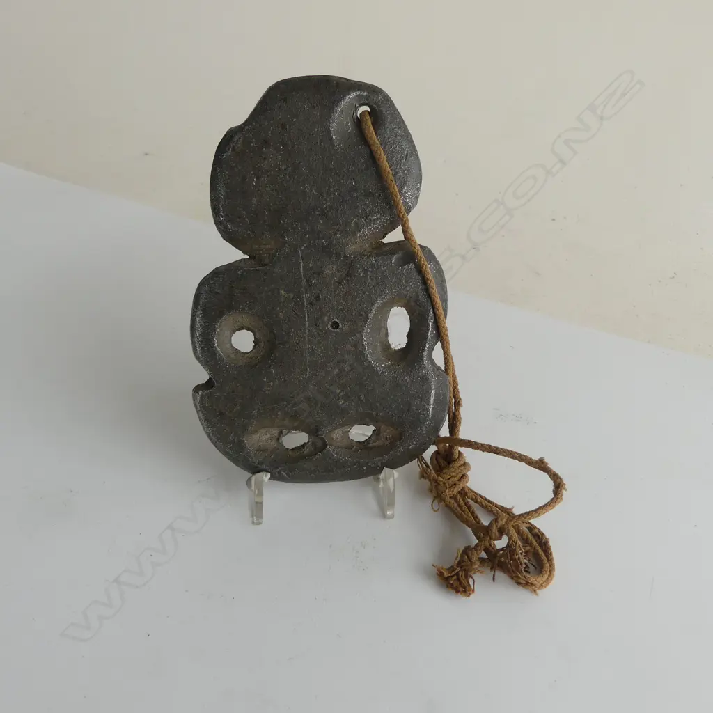 An old and uncommon Māori cast solid lead hei tiki, Image 1++