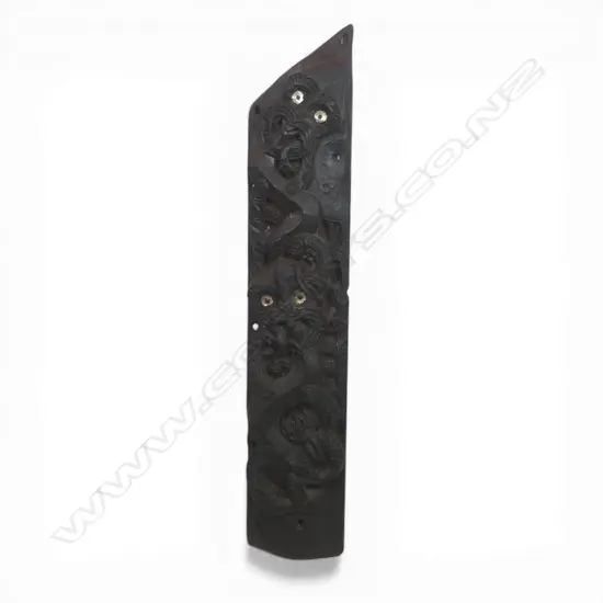 An old Māori carved ammo whare front board,