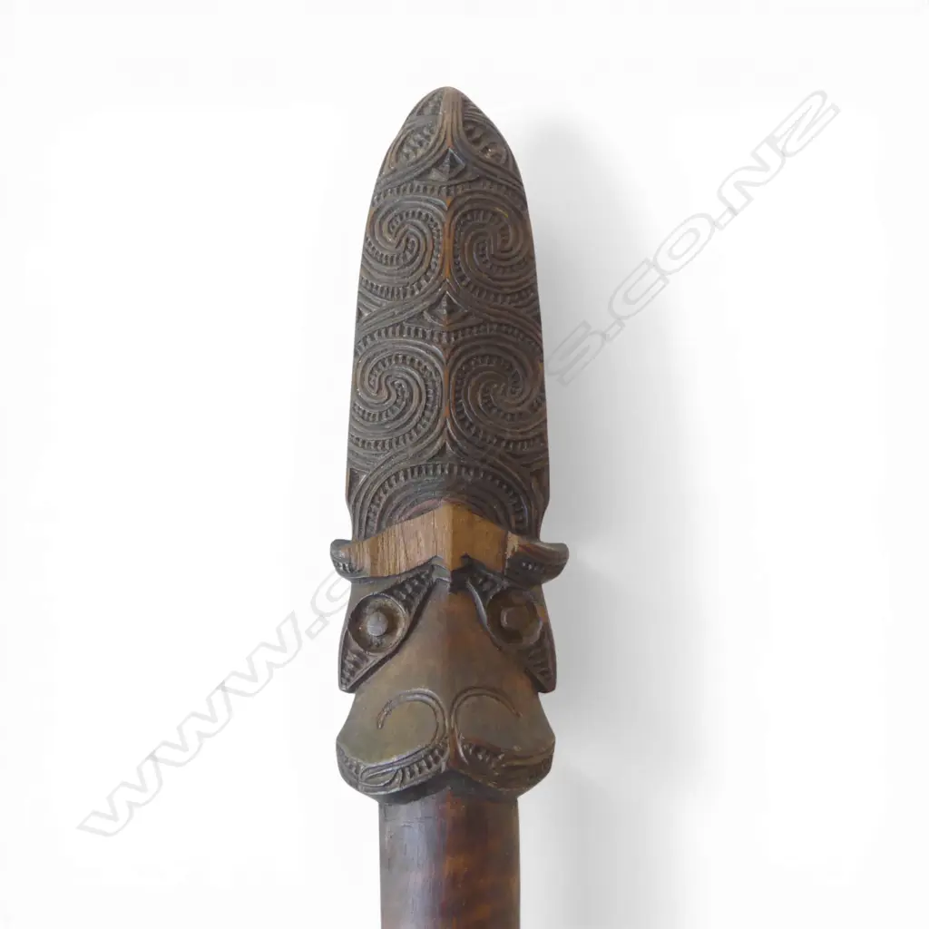 An old Maori broken taiaha - joined and with the middle section absent, traditional carved head with lineal scroll and notch detail to the extended tongue end - some faults. L.790mm. Registered Y760 - must be a registered Maori artefact collector to purchase. Image 1++