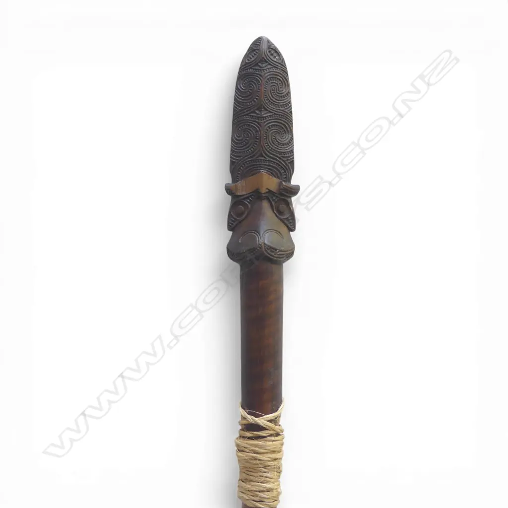 An old Maori broken taiaha - joined and with the middle section absent, traditional carved head with lineal scroll and notch detail to the extended tongue end - some faults. L.790mm. Registered Y760 - must be a registered Maori artefact collector to purchase. Image 1++