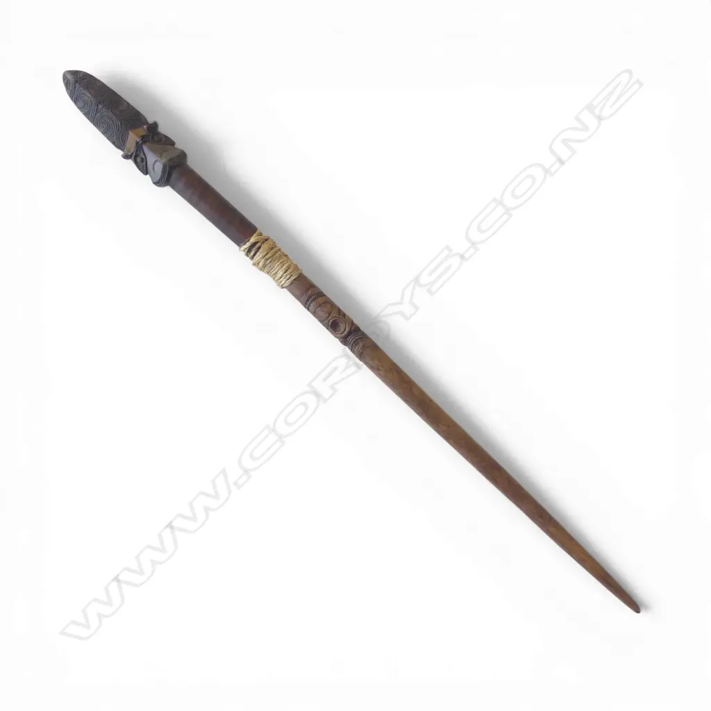 An old Maori broken taiaha - joined and with the middle section absent, traditional carved head with lineal scroll and notch detail to the extended tongue end - some faults. L.790mm. Registered Y760 - must be a registered Maori artefact collector to purchase. Image 1++