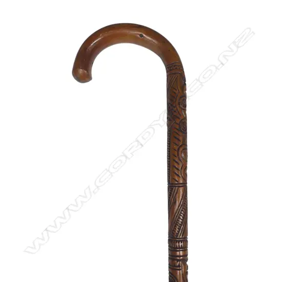 A 20thC Māori carved walking stick, with bands of figure,