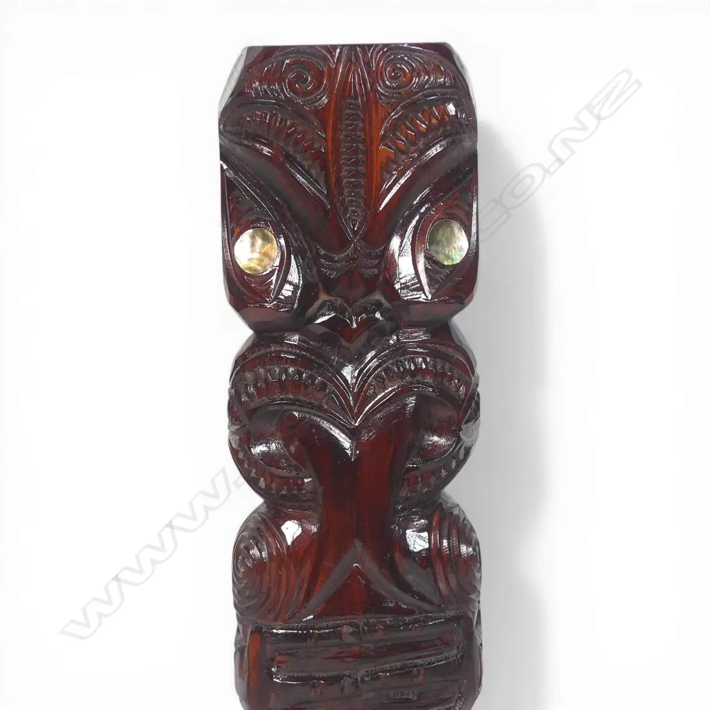 Mid / late 20thC Māori carved standing pou (post/figure), with extended forked tongue and paua disc eyes. Dark stained finish. H.565mm. Image 1++