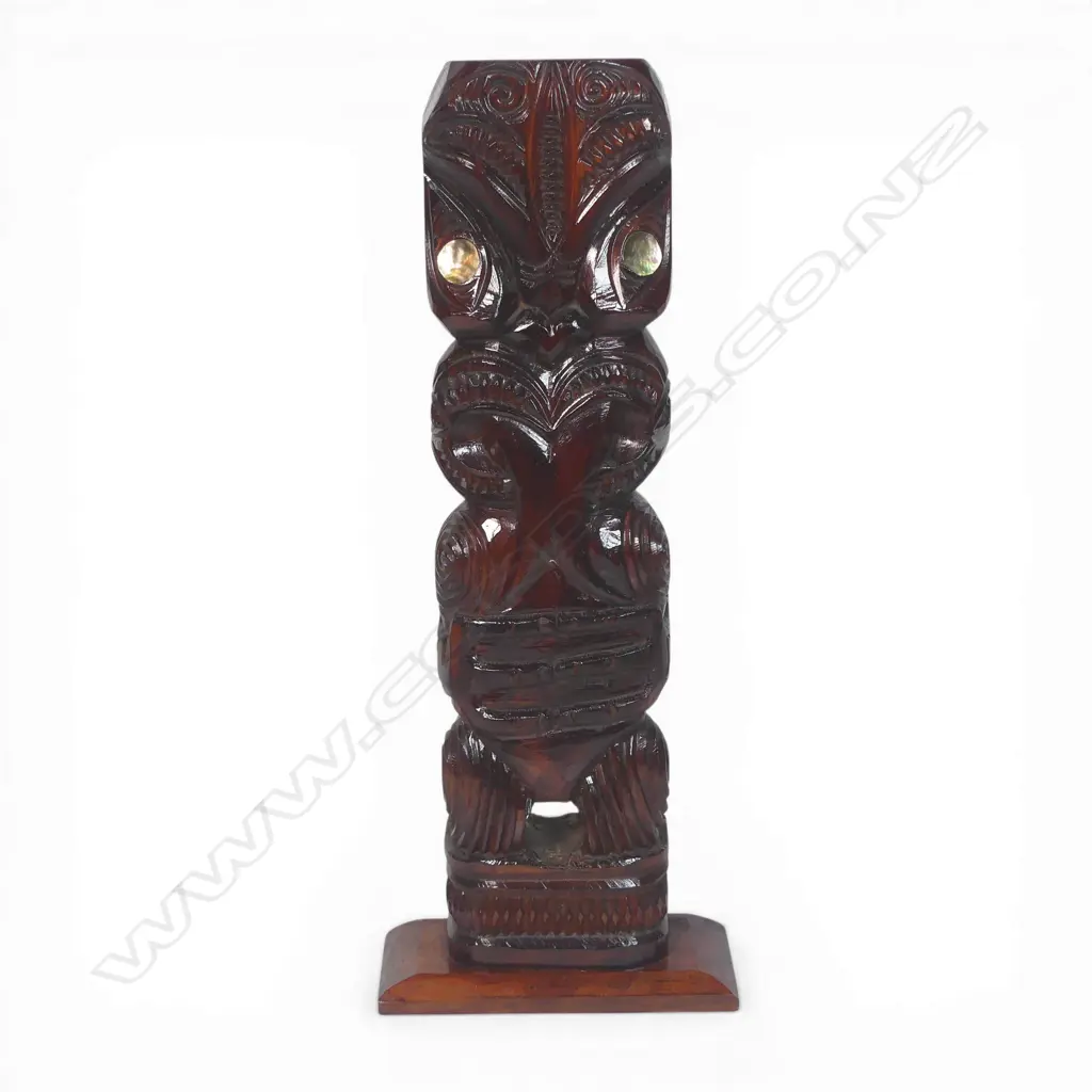 Mid / late 20thC Māori carved standing pou (post/figure), with extended forked tongue and paua disc eyes. Dark stained finish. H.565mm. Image 1++