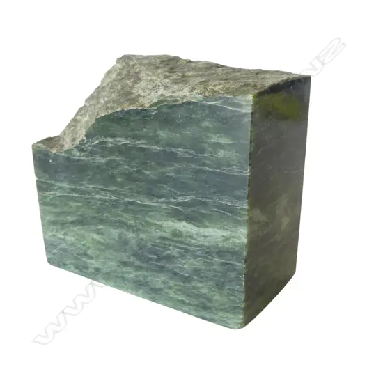 Cut block of New Zealand pounamu with one natural shaped surface,