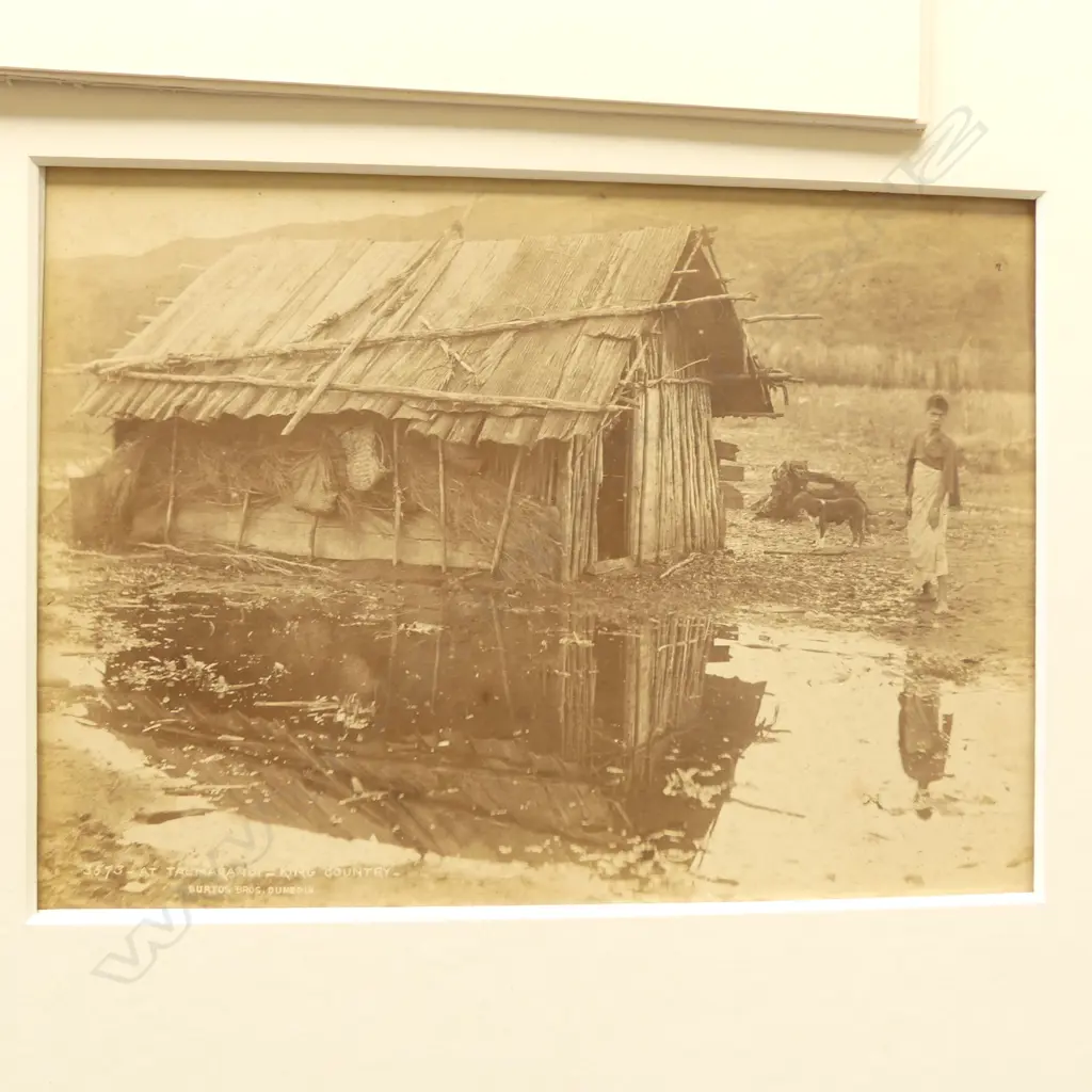 Burton Bros, Three vintage photographs, 'Taumaranui - King Country', 'Meeting of Great Chiefs at Whare-Komiti, King Country', Te Aroha .. (titled indistinctly), plus futher images of a Tekoteko by photographer unknown,  'Avonside, Christchurch' and a group of men. Image 1++