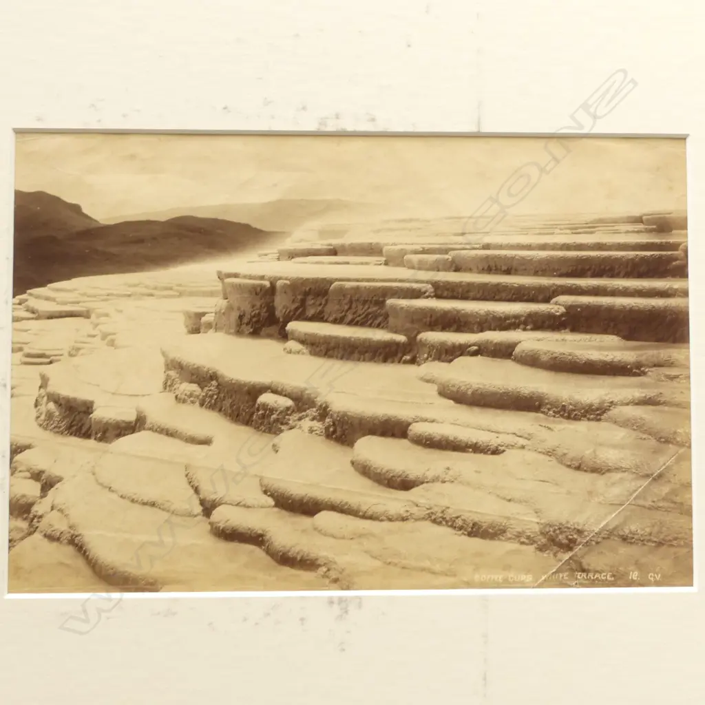 Seven vintage photographs including 'Looking down Wanganui River at Koroniti', 'Echo Lake, Dec '87' by Burton Bros, 'Echo Lake and Hole in the Wall Crater, Rotomahana', 'South Crater, The Termination of Rotomahana' and 'Coffee Cups, White Terrace' by George Valentine plus two further images of Mitre Peak and river scene by photographers unknown. Image 1++