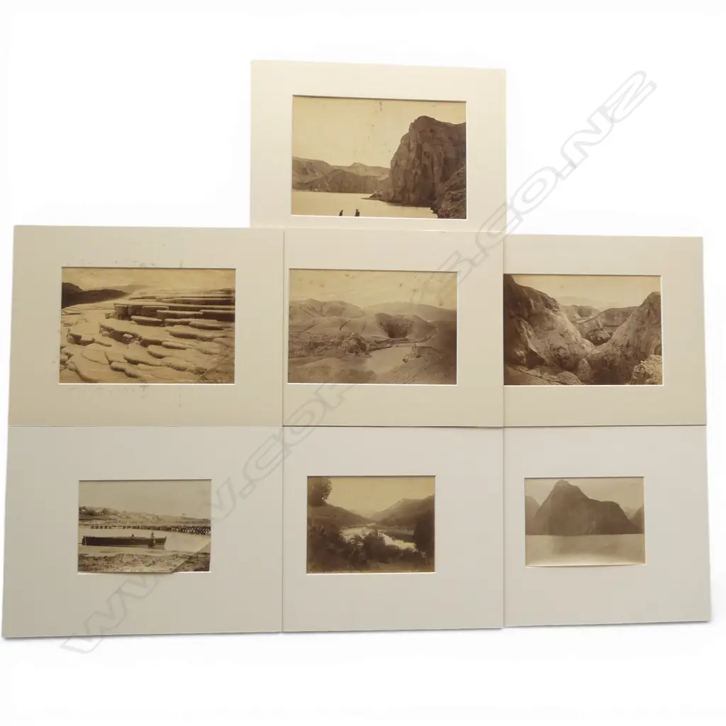 Seven vintage photographs including 'Looking down Wanganui River at Koroniti', 'Echo Lake, Dec '87' by Burton Bros, 'Echo Lake and Hole in the Wall Crater, Rotomahana', 'South Crater, The Termination of Rotomahana' and 'Coffee Cups, White Terrace' by George Valentine plus two further images of Mitre Peak and river scene by photographers unknown. Image 1++