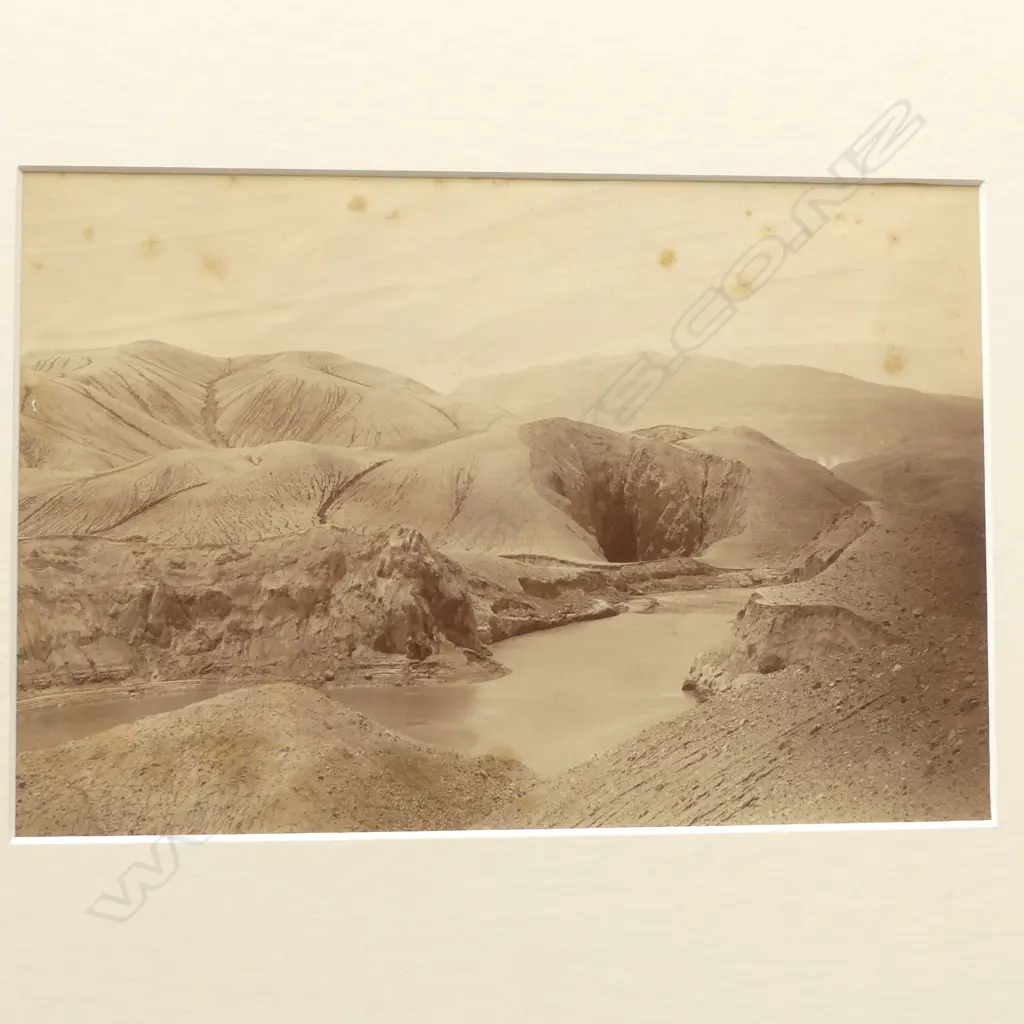 Seven vintage photographs including 'Looking down Wanganui River at Koroniti', 'Echo Lake, Dec '87' by Burton Bros, 'Echo Lake and Hole in the Wall Crater, Rotomahana', 'South Crater, The Termination of Rotomahana' and 'Coffee Cups, White Terrace' by George Valentine plus two further images of Mitre Peak and river scene by photographers unknown. Image 1++