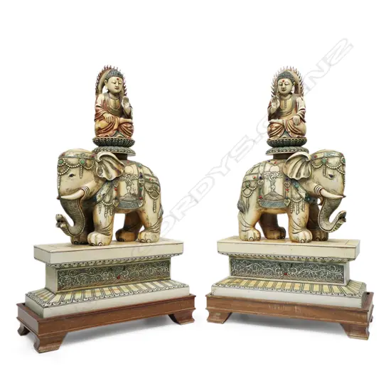 A pair of vintage ivory elephant figures,